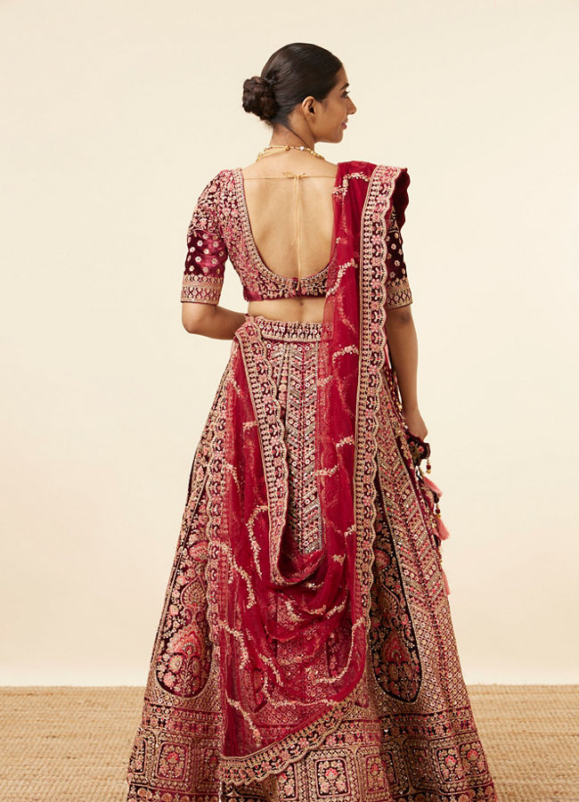 alt message - Mohey Women Maroon Embellished Bridal Lehenga image number 3